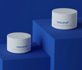 Applying Nescens lipid-replenishing cream to face